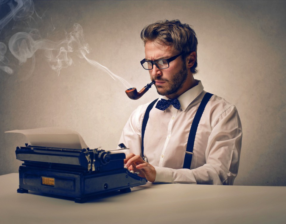 Man typing on an old copywriting machine